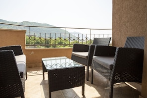 Private furnished balcony with view of the town