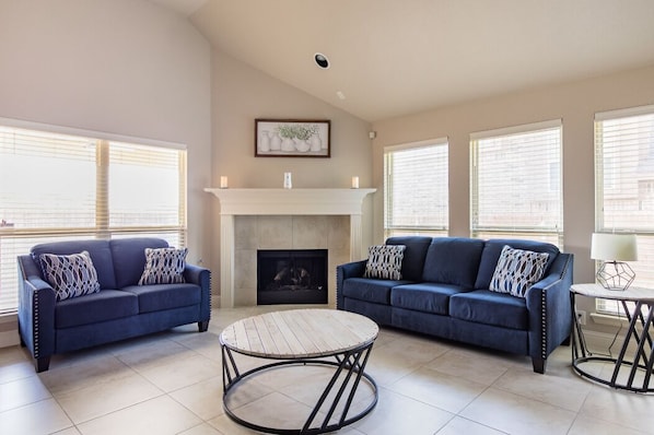 Great room with open floorplan - plenty of natural light, seating, and large TV!