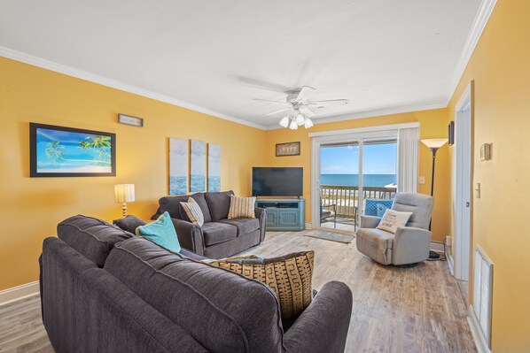 The ocean front living room is well-appointed with comfortable furnishings.