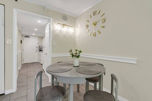 A dining area for four people where you can talk over a delicious meal.