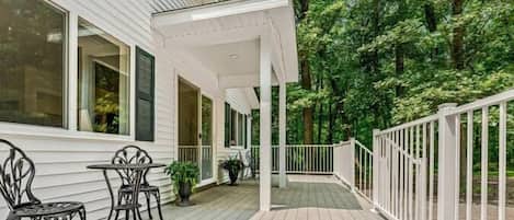 Front deck with wooded view beyond