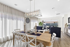 With a large dining table and an outdoor BBQ area, this space is perfect for family meals or entertaining