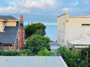 This peaceful setting offers views across Half Moon Bay from the covered upper balcony & living room.