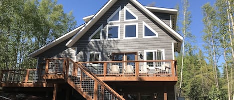 The back of the home with spectacular views from both inside and outside.