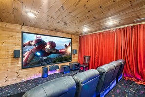 Private home cinema with luxury leather recliner theater seating for 11. 120" 4K projector screen and a professional surround sound system. Apple TV for streaming any movie you would like.