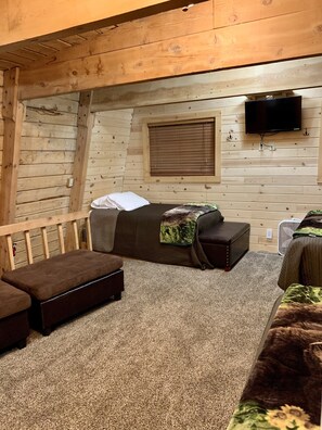 Spacious loft located at the top of the stairs.