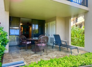 Big patio with ocean view on left and garden on the right.