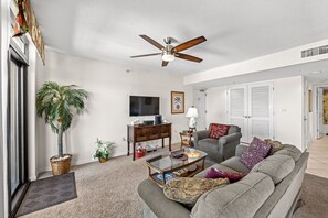 This comfy living room offers space for everyone to gather!