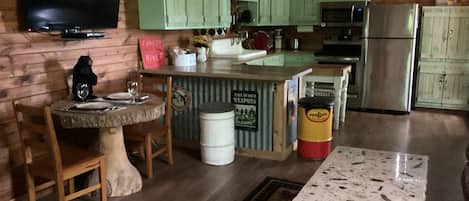 Repurposed kitchen with pallet cabinets.