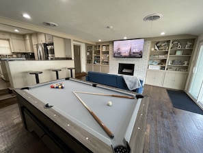 Game room with pool table and ping pong table 
75” smart tv
Futon

