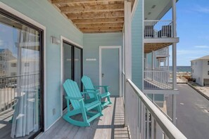 Balcony has 2 rocking chairs