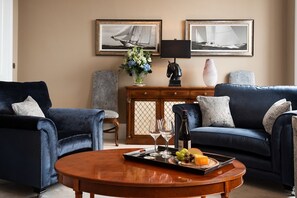 The Linen House - the sumptuous, deep blue armchairs in the drawing room are the perfect spot for an apÃ©ritif