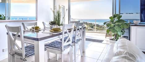 Enjoy panoramic ocean views from the living, kitchen and dining area.