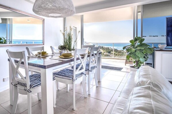 Enjoy panoramic ocean views from the living, kitchen and dining area.