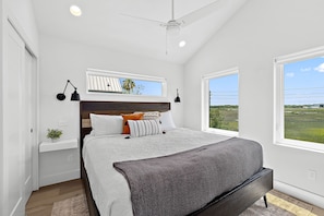 The master bedroom is equipped with King bed with direct views of the marsh