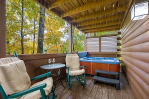 Priivate outdoor hot tub with comfy deck seating