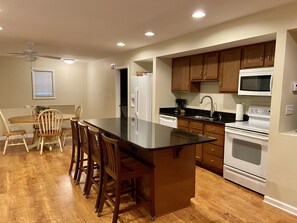 Dining room and kitchen with bar.  This also opens up to the living room area.