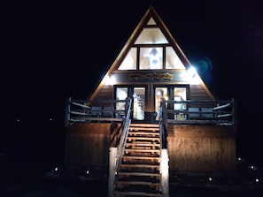 Front of cabin at night