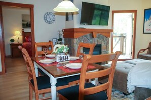 Seating for 4 at the dining table is perfect for more formal eating, or games