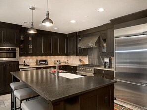 Large, fully stocked gourmet kitchen.