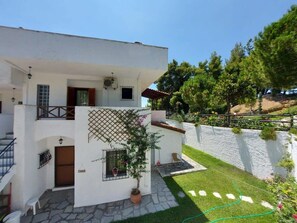 Appreciate the outward charm of the property, where a blend of design and nature creates a welcoming atmosphere
