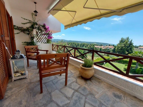 Unwind on the villa's veranda and savor the breathtaking view