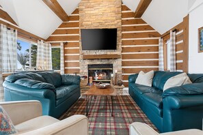 *Living room area with wood-burning fireplace.