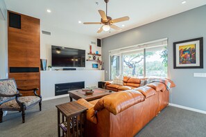 Enjoy high-end 75" TV, 5.1-channel surround sound and a cozy gas fireplace