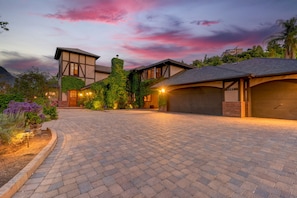 Front entrance of house with giant private driveway for 10+ cars.