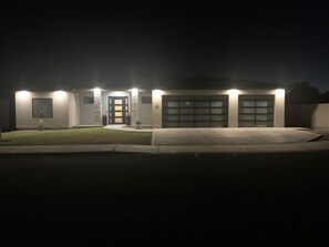 Front of house at night. 