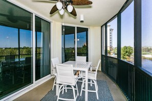 Large screened in balcony where you can start your day with a cup of coffee