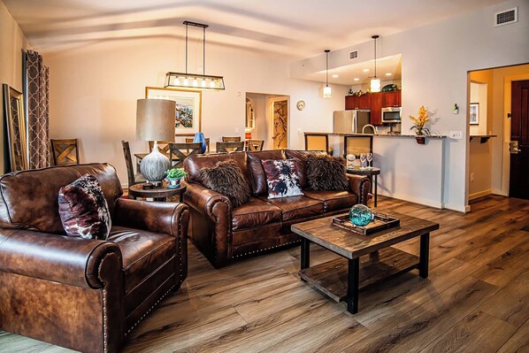 Living Area to Kitchen and Foyer