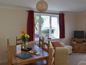 A farmhouse style kitchen table provides a welcoming space for both formal and informal dining | Lambs Gate - Newbarn Farm, Collaton St Mary, near Paignton