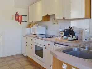 The well-equipped kitchen area is furnished in a modern yet traditional style | Lambs Gate - Newbarn Farm, Collaton St Mary, near Paignton