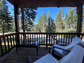 Deck with patio furniture (available in summer) overlooking the mountains.
