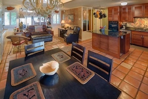 Dining Room with Kitchen and Front Room in Background