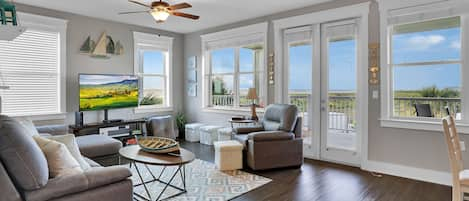 Great room concept with great bay views out a wall of windows.  