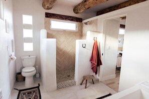 Luxury shower inclusive of spacious dual sink vanity and gorgeous tiled shower.