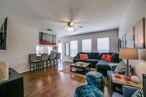 Spacious couch, with breakfast bar for great conversations. 