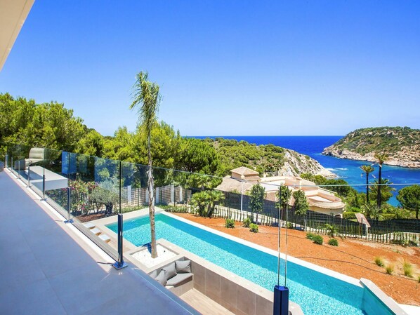 Water, Sky, Plant, Property, Building, Seaside Resort, Azure, Swimming Pool, Tree, Outdoor Furniture