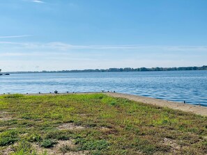 Backyard view with cleats to tie off jet skis and/or boat