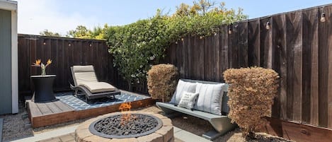 Warm yourself with our firepit at night in the backyard or soak in the morning sun.