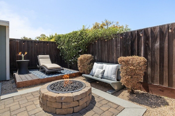 Warm yourself with our firepit at night in the backyard or soak in the morning sun.