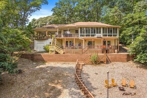 Our back yard is home to multiple outdoor patios, a firepit with views to the lake, and a private staircase perfect for a quick walk down to the lake.