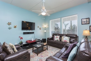 Living area surrounds a Large Flat Screen TV