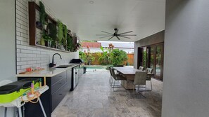 Undercover breeze way BBQ area overlooking the pool