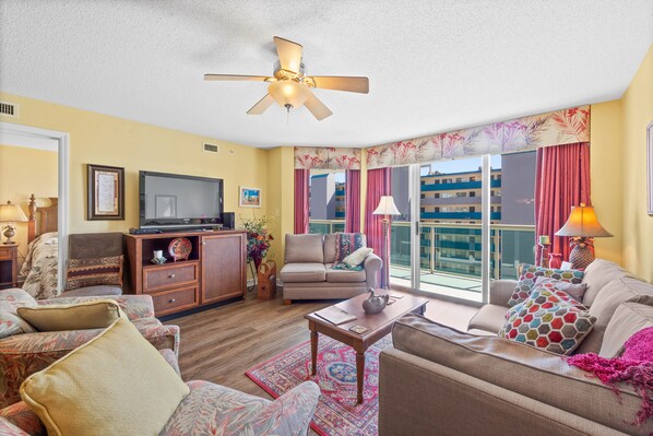 Relax in the comfort of a large well-appointed living room with an ocean view.