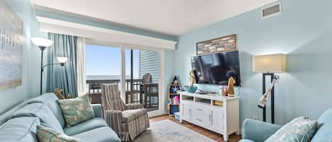 The ocean front living room is well-appointed with comfortable furnishings.