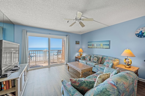 The ocean front living room is well-appointed with comfortable furnishings.