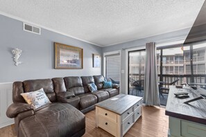 This comfy living room offers space for everyone to gather!